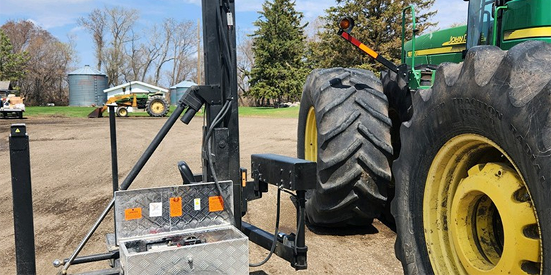 Picture of a John Deere tractor with an attached power lift